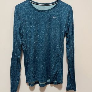Blue and white speckled womens nike long sleeve running shirt.